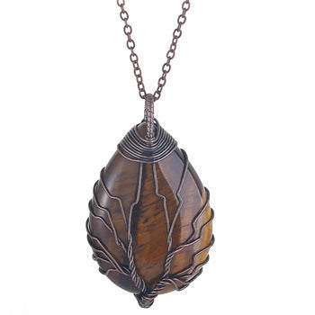 Brown teardrop-shaped pendant on a chain against a white background