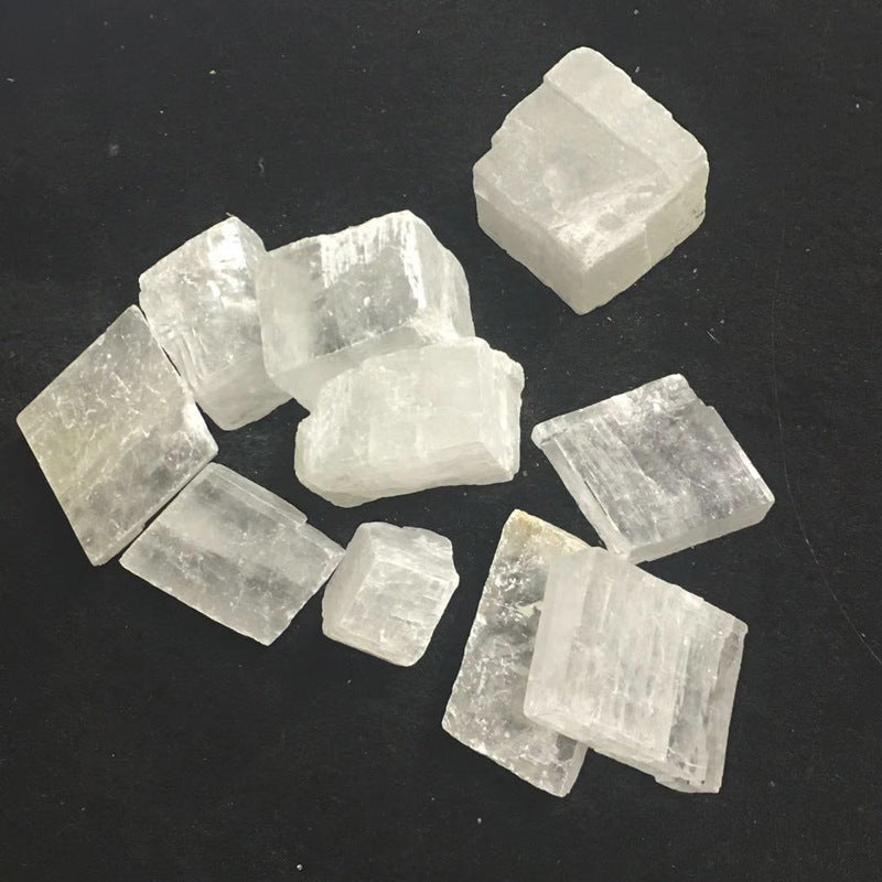 Raw selenite crystals on a black background