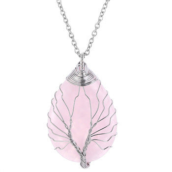 Pink leaf-shaped pendant on a silver chain against a white background