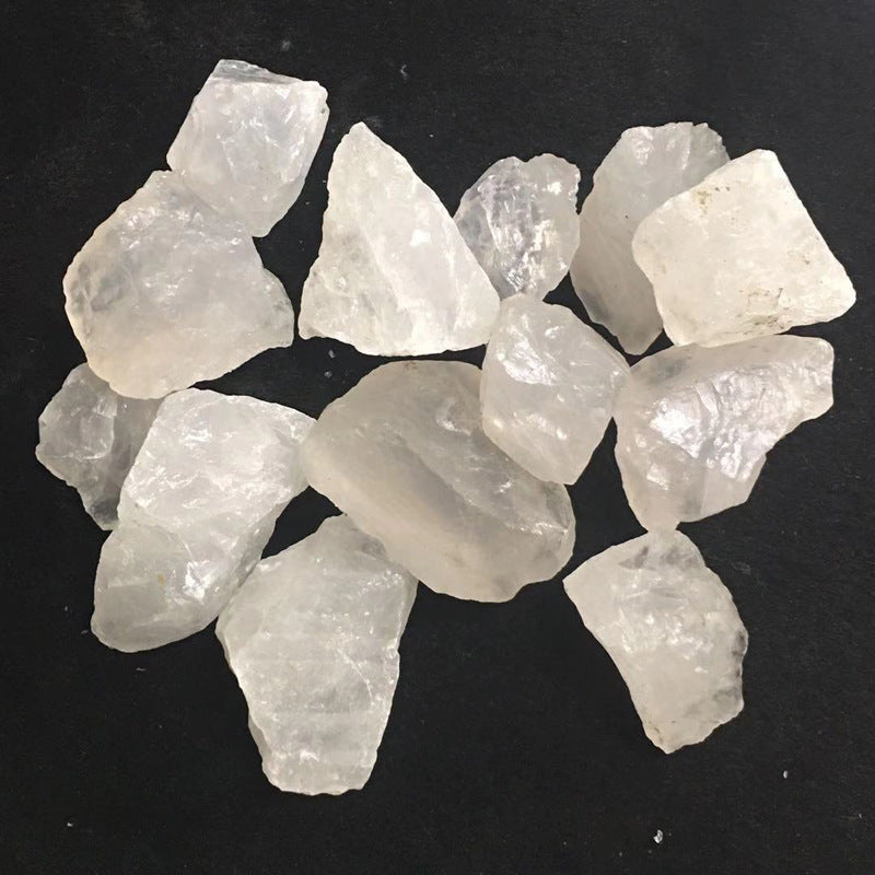 Collection of raw, translucent crystals on a black background