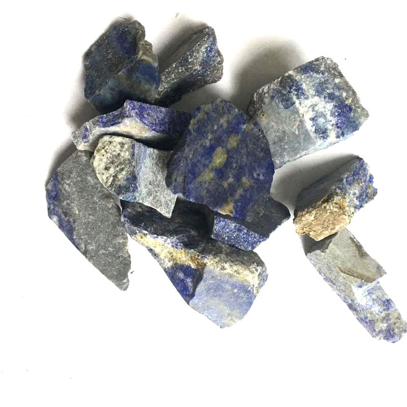 Raw lapis lazuli stones on a white background