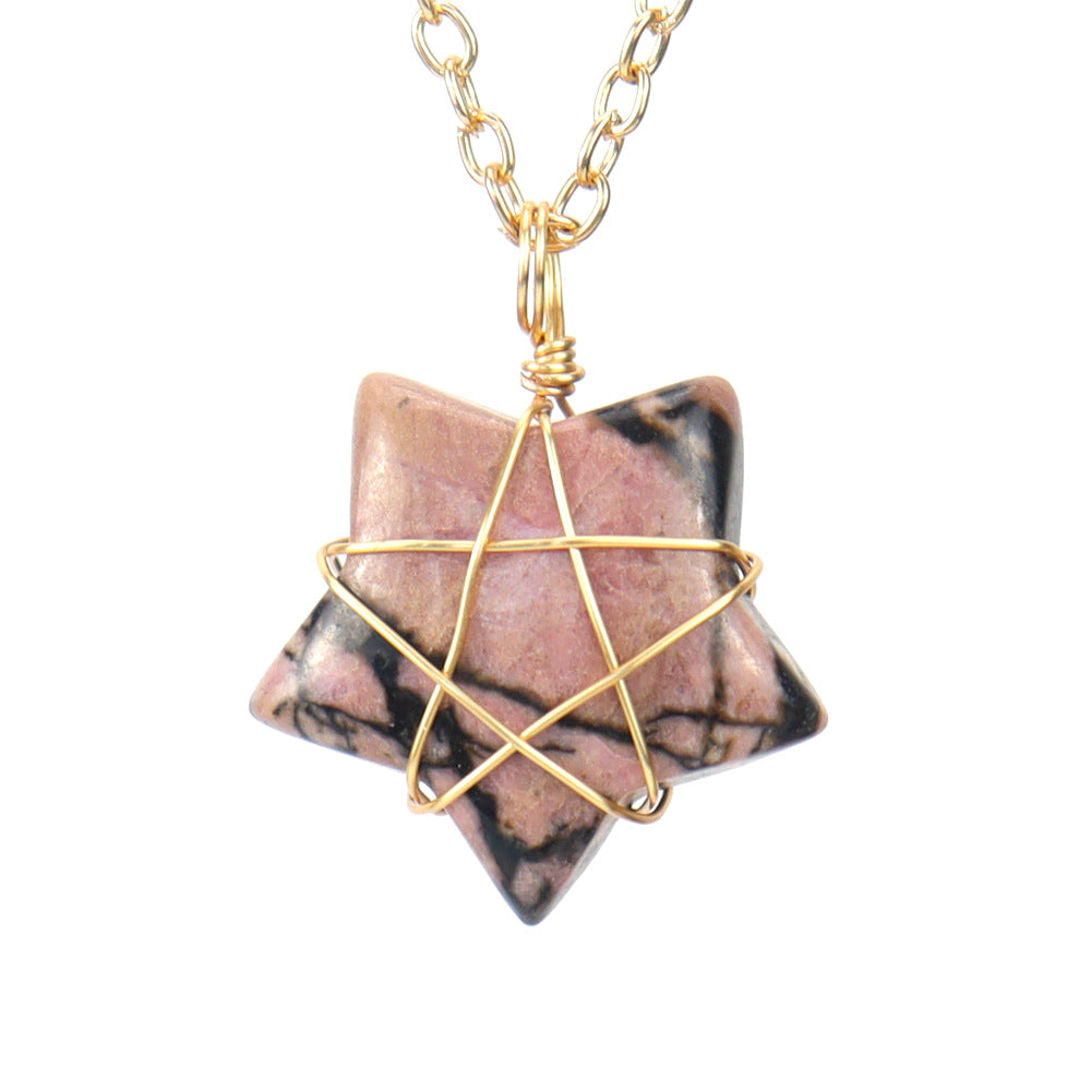 Necklace with a pink stone pendant and gold wire wrapping on a white background